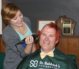 WSLH Purchasing Manager Mark Conklin decided that since he was having his hair shaved off, he would have fun with it for a few days and dyed it red last weekend. 