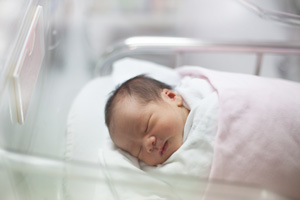 A newborn baby in a hospital nursery. The Wisconsin State Laboratory of Hygiene's Newborn Screening Laboratory screens newborns in Wisconsin for 44 rare, serious disorders that left untreated can lead to severe health issues.