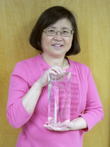 Dr. Mei Baker with her APHL award.