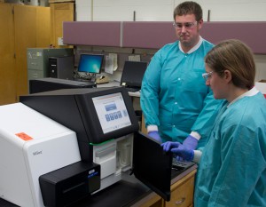 WSLH Microbiologists Rich Griesser and Tonya Danz performing Whole Genome Sequencing testing on influenza viruses.