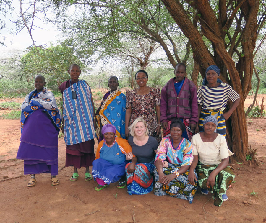 Erin (front row – 2nd from left) visits with midwives in Nadaruru, a village of the Masai tribe. The woman standing behind Erin is a staffer with Empower Tanzania. The man next to her (back row -- 2nd from right) is the village’s Chief who, alarmed at the village’s high infant and maternal mortality rates, invited Empower Tanzania to teach midwifery to women in the village. 