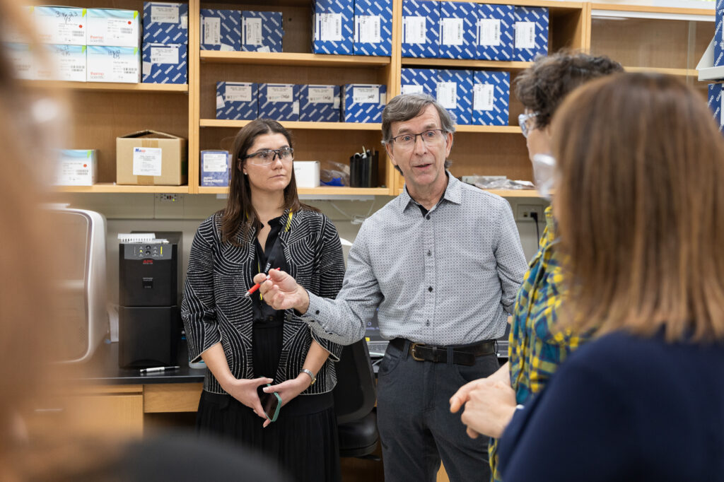 Dr. Martin Shafer and Dr. Adelaide Roguet explain the WSLH’s wastewater surveillance program to Dr. Cohenand her aide Casey Garay.